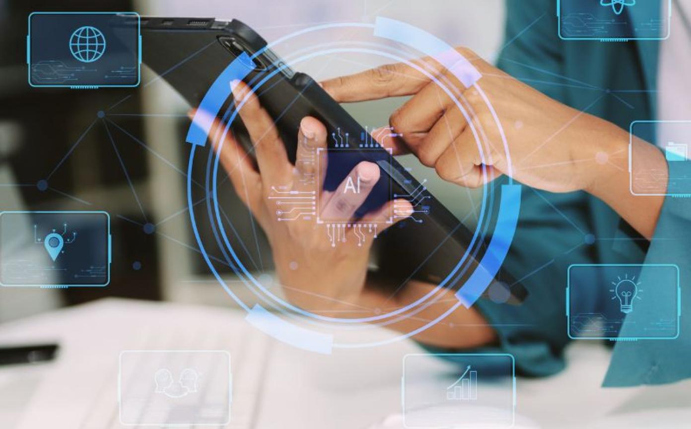 Image of a person's hands holding a tablet as an invitation to the webinar Conversational Agents for Smoking Cessation